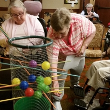 Labor Day Fair Games-Shoreview Senior Living-tenant trying to find the right stick to pull